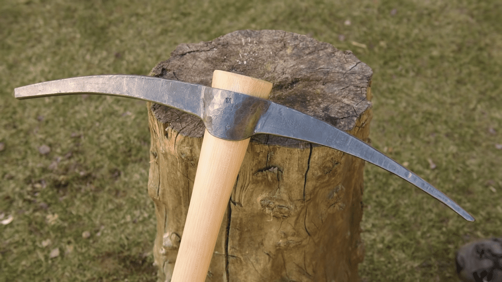 pick axe in Sanskrit is called खनित्रम् / स्वह्स्तिका (Khanitram/Swahstika)